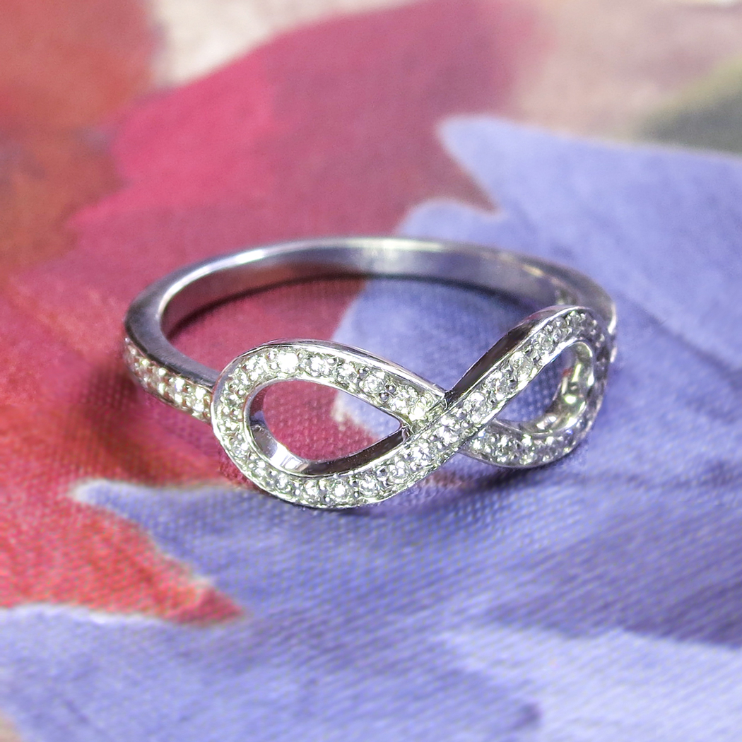 1/6 Ctw Round Cut Diamond Infinity Ring in 10K White Gold | Ross Elliott  Jewelers | Terre Haute, IN