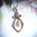 Antique Victorian .66 ctw. Diamond Bow Pendant Platinum 18K