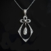 Antique Victorian .66 ctw. Diamond Bow Pendant Platinum 18K